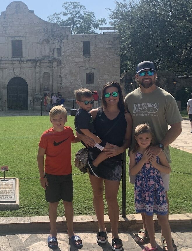 Adam and his family in front of the Alamo