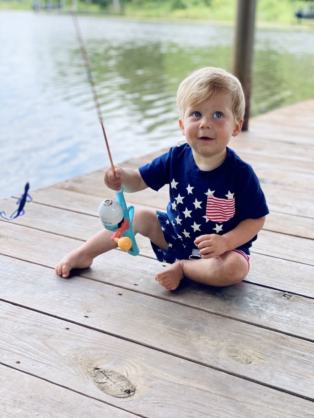 Drew's son with a fishing pole